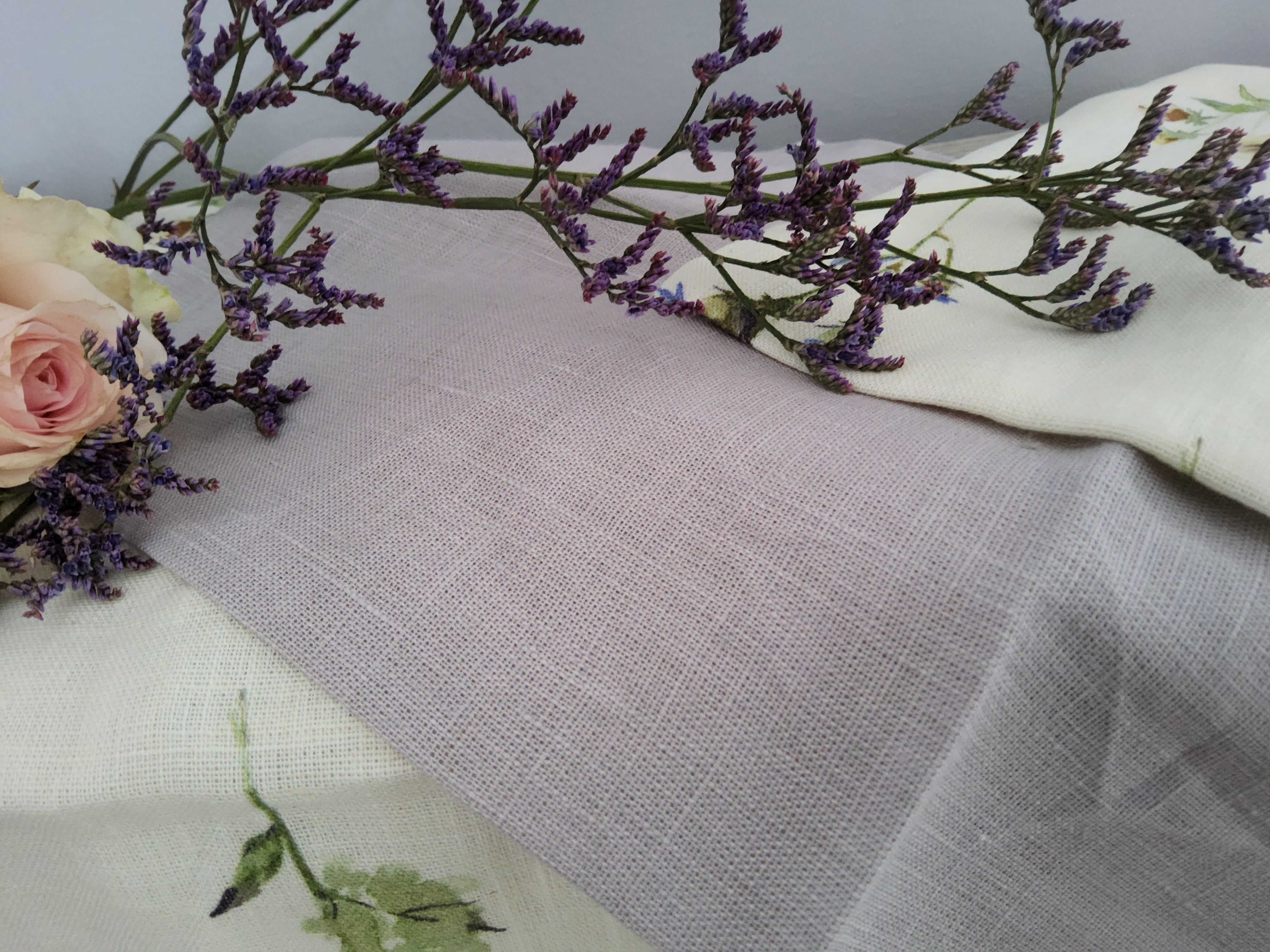 Set of four shabby chic floral cloth napkins in lilac with vintage-inspired design, perfect for elegant table decor.