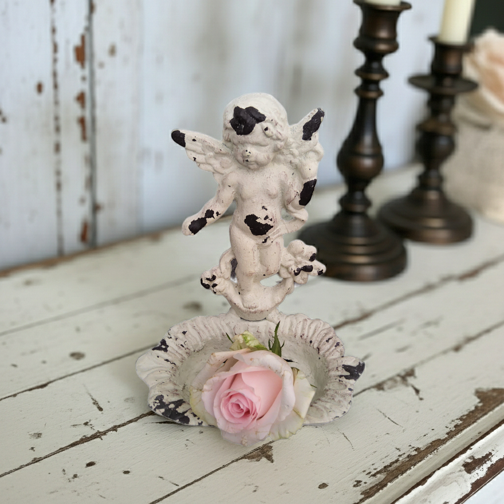 Antique white cast iron soap holder featuring a shabby chic angel cherub design, perfect for vintage bathroom decor.