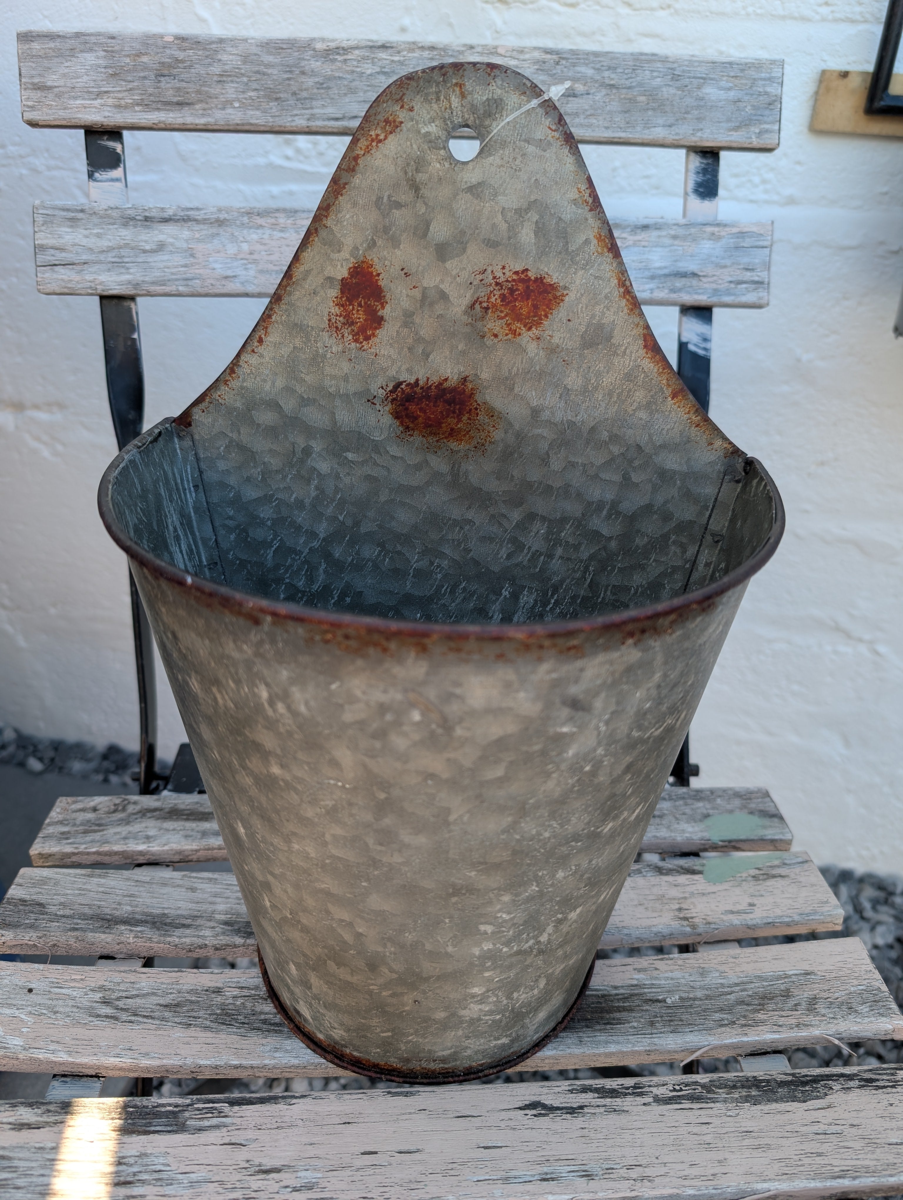 Vintage metal wall fountain planter from shabbychicdecor.co.uk featuring rustic shabby chic garden decor with weathered finish and floral accents.