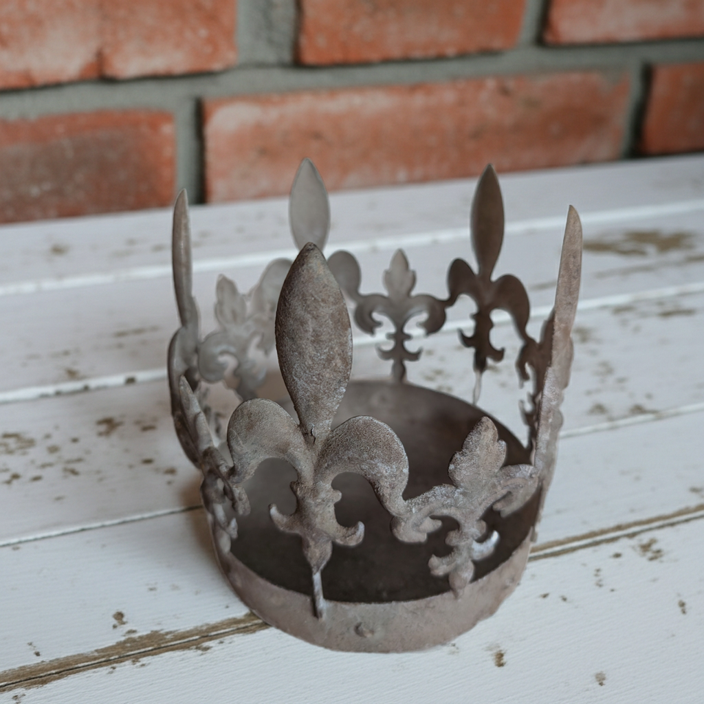 Vintage decorative metal crown with shabby chic fleur-de-lis design, ornate metalwork, ideal for shabby chic or antique decor.