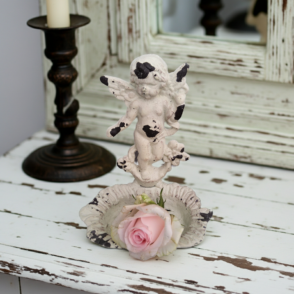 Antique white cast iron soap holder featuring a shabby chic angel cherub design, ideal for vintage bathroom decor.